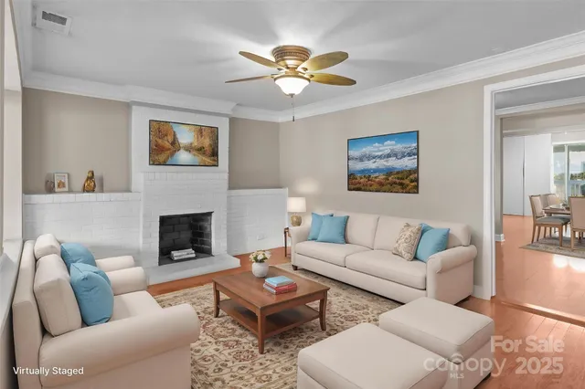 a living room with furniture a couch and a fireplace