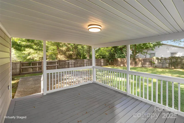 a view of a porch with wooden floor