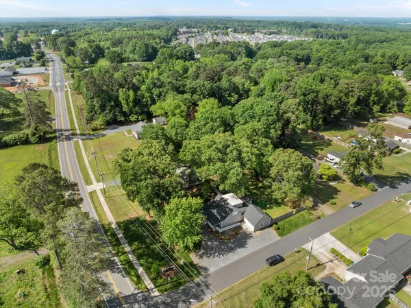 an aerial view of houses with yard
