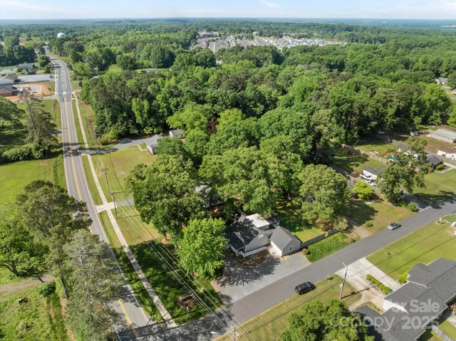 an aerial view of houses with yard