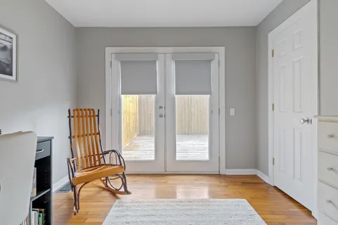 a view of livingroom with furniture and workspace
