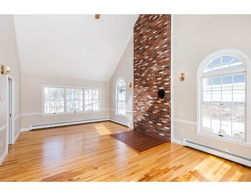 7 Roosevelt Road Lexington, MA 02421 - Photo 15 of 28 a view of an empty room with wooden floor and a window