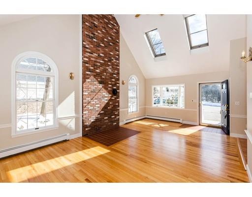 7 Roosevelt Road Lexington, MA 02421 - Photo 16 of 28 a view of an empty room with wooden floor and a window