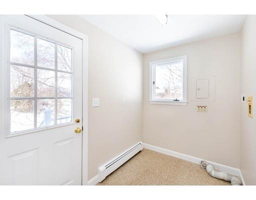 7 Roosevelt Road Lexington, MA 02421 - Photo 17 of 28 an empty room with wooden floor and windows