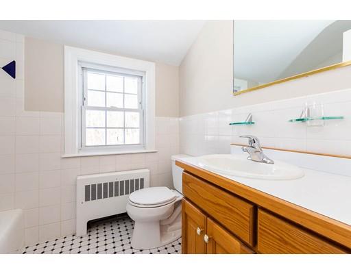 7 Roosevelt Road Lexington, MA 02421 - Photo 24 of 28 a bathroom with a sink a toilet and a window