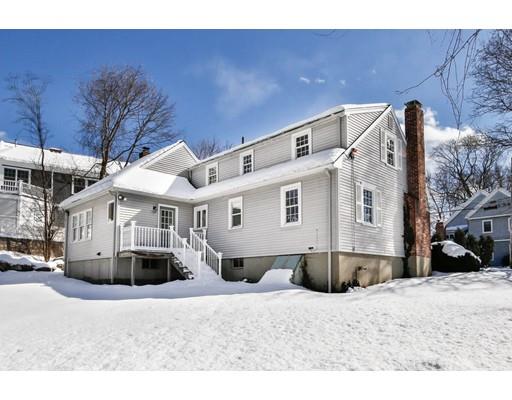 7 Roosevelt Road Lexington, MA 02421 - Photo 27 of 28 a front view of a house with a large tree