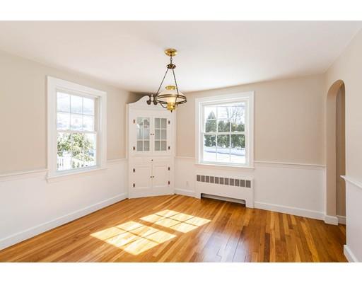 7 Roosevelt Road Lexington, MA 02421 - Photo 7 of 28 a view of empty room with wooden floor and fan