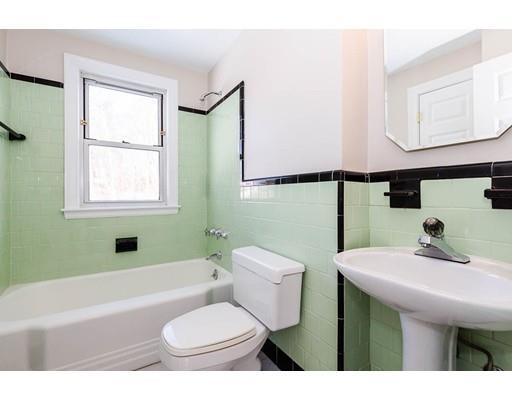 7 Roosevelt Road Lexington, MA 02421 - Photo 8 of 28 a bathroom with a sink a toilet and tub