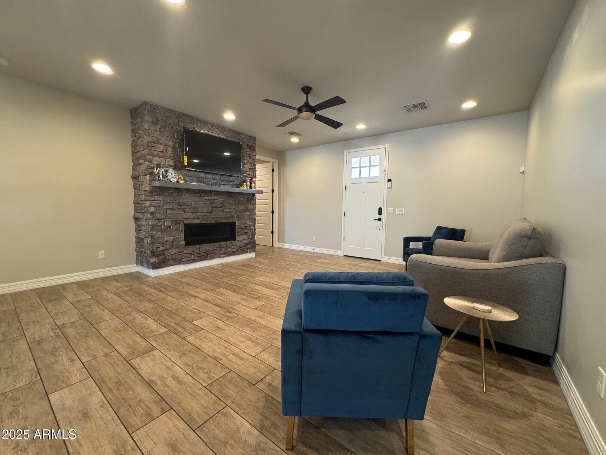 4350 East Kings Avenue Phoenix, AZ 85032 - Photo 3 of 15 a living room with furniture and a fireplace