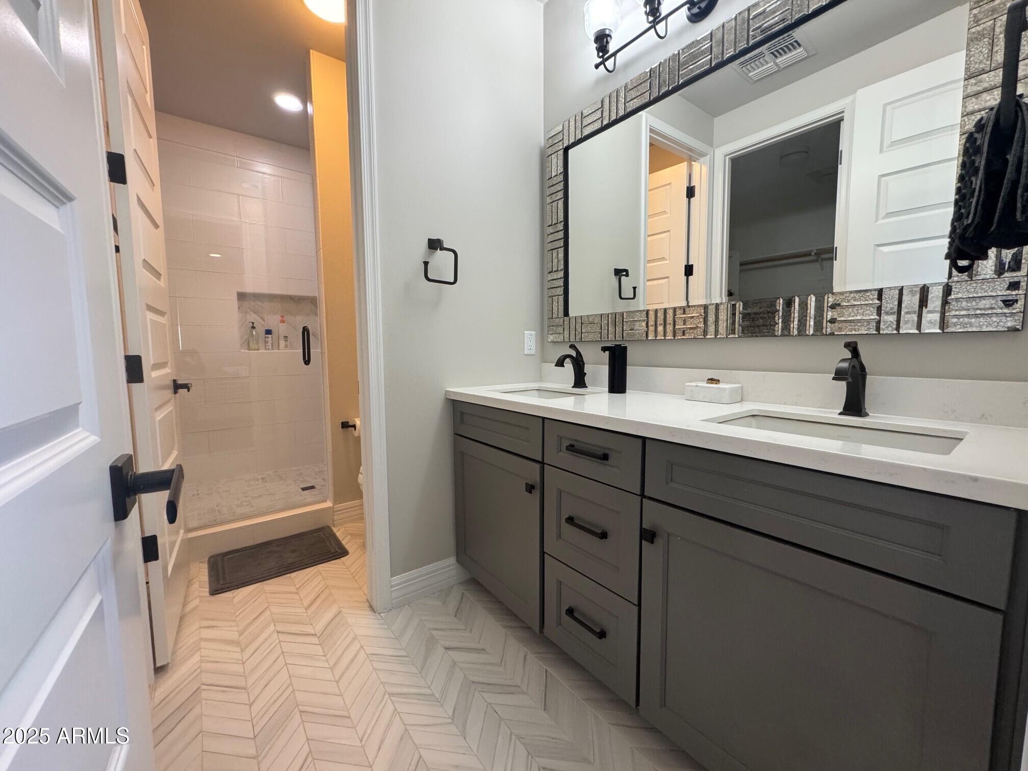 4350 East Kings Avenue Phoenix, AZ 85032 - Photo 8 of 15 a bathroom with a sink double vanity and a mirror