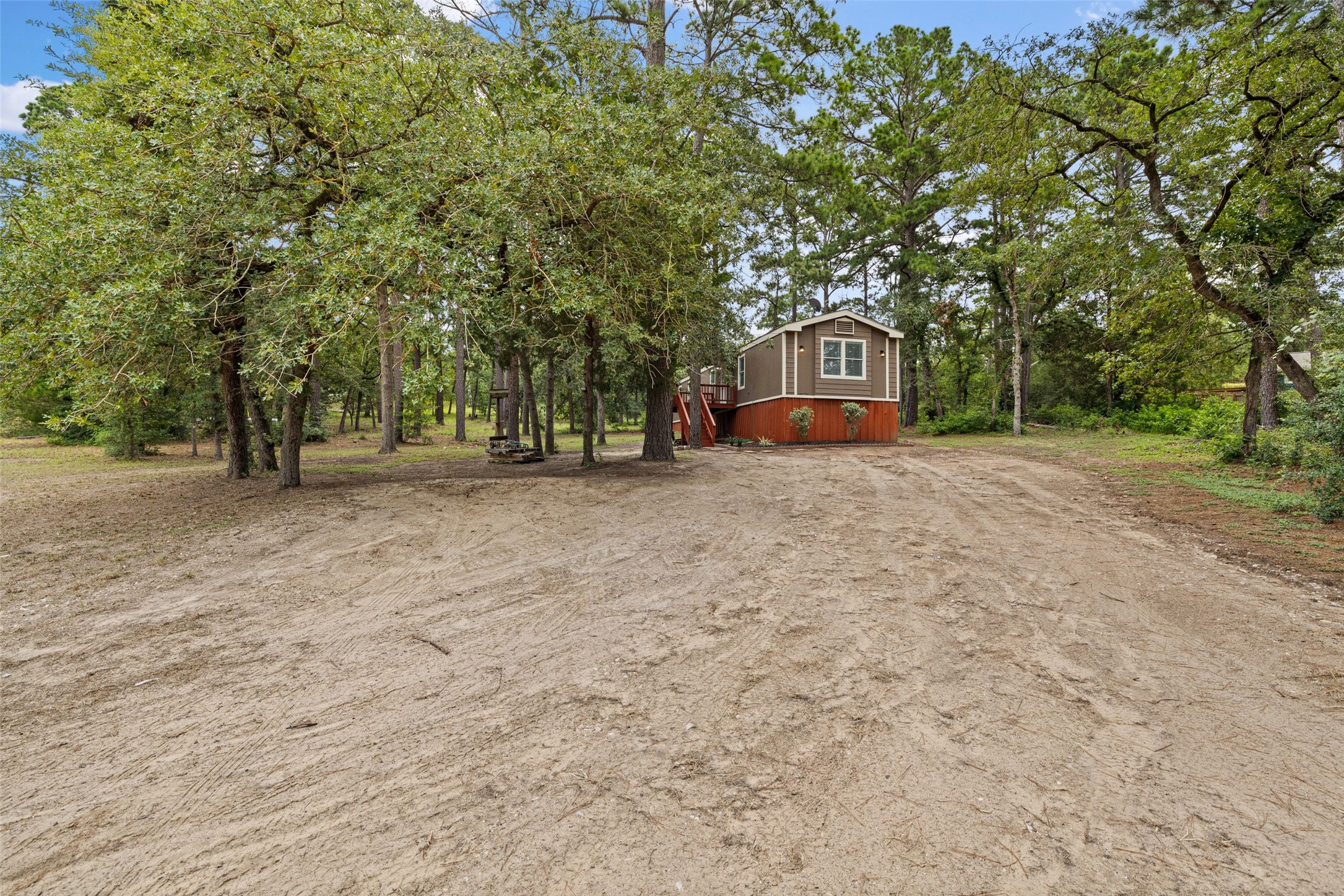 301 Porter Road, Unit A Bastrop, TX 78602 - Photo 25 of 28 a front view of a house with a trees