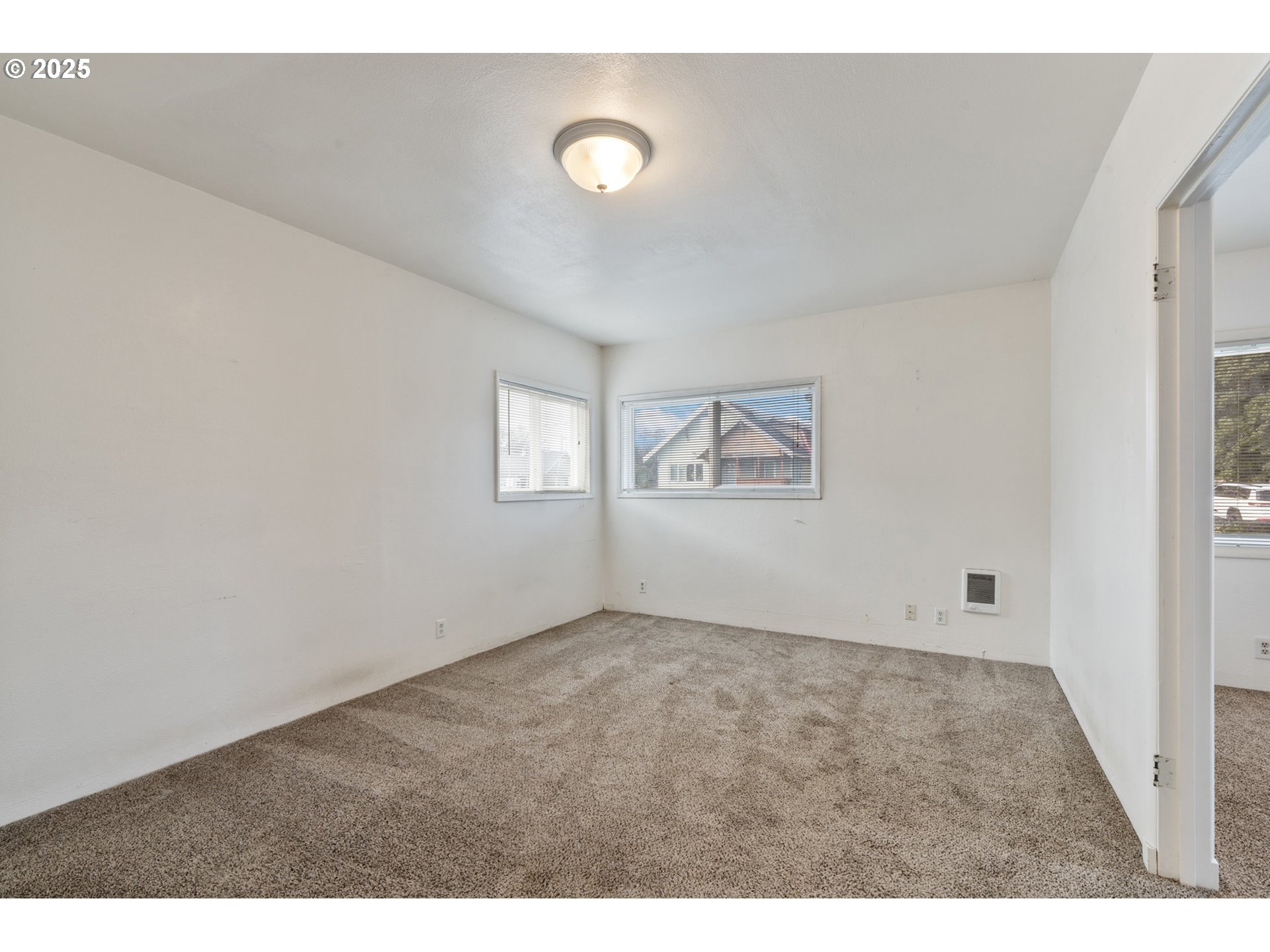 1307 3rd Street Tillamook, OR 97141 - Photo 11 of 42 a view of an empty room with a window
