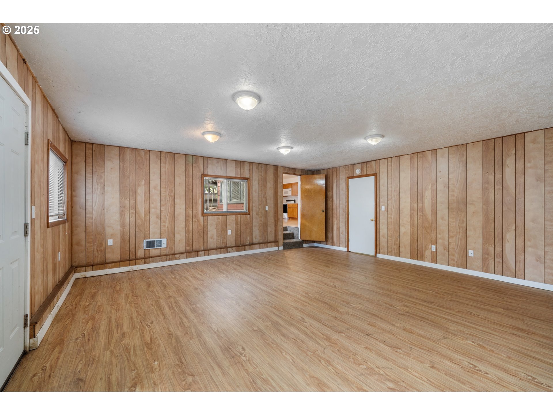 1307 3rd Street Tillamook, OR 97141 - Photo 19 of 42 a view of an empty room with wooden floor