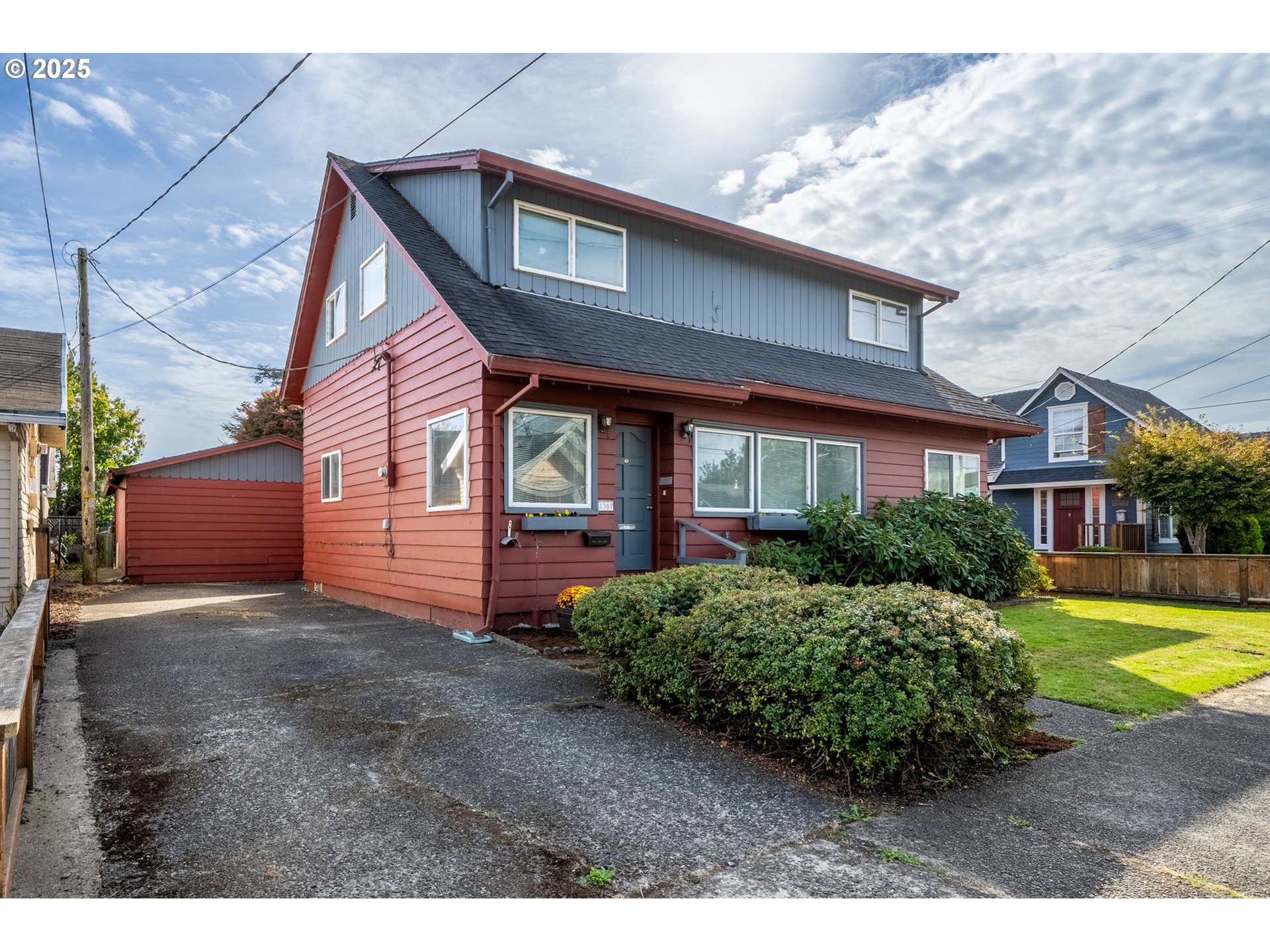 1307 3rd Street Tillamook, OR 97141 - Photo 2 of 42 a front view of a house with garden