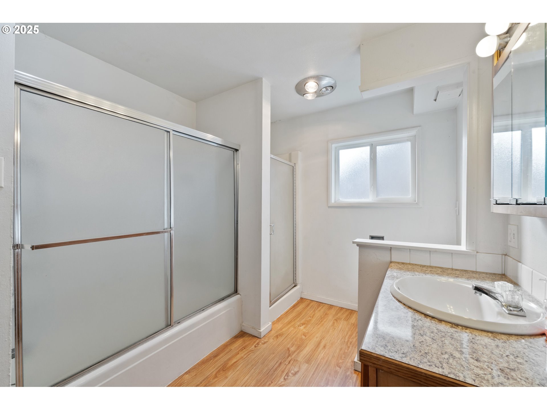 1307 3rd Street Tillamook, OR 97141 - Photo 22 of 42 a bathroom with a sink and a mirror