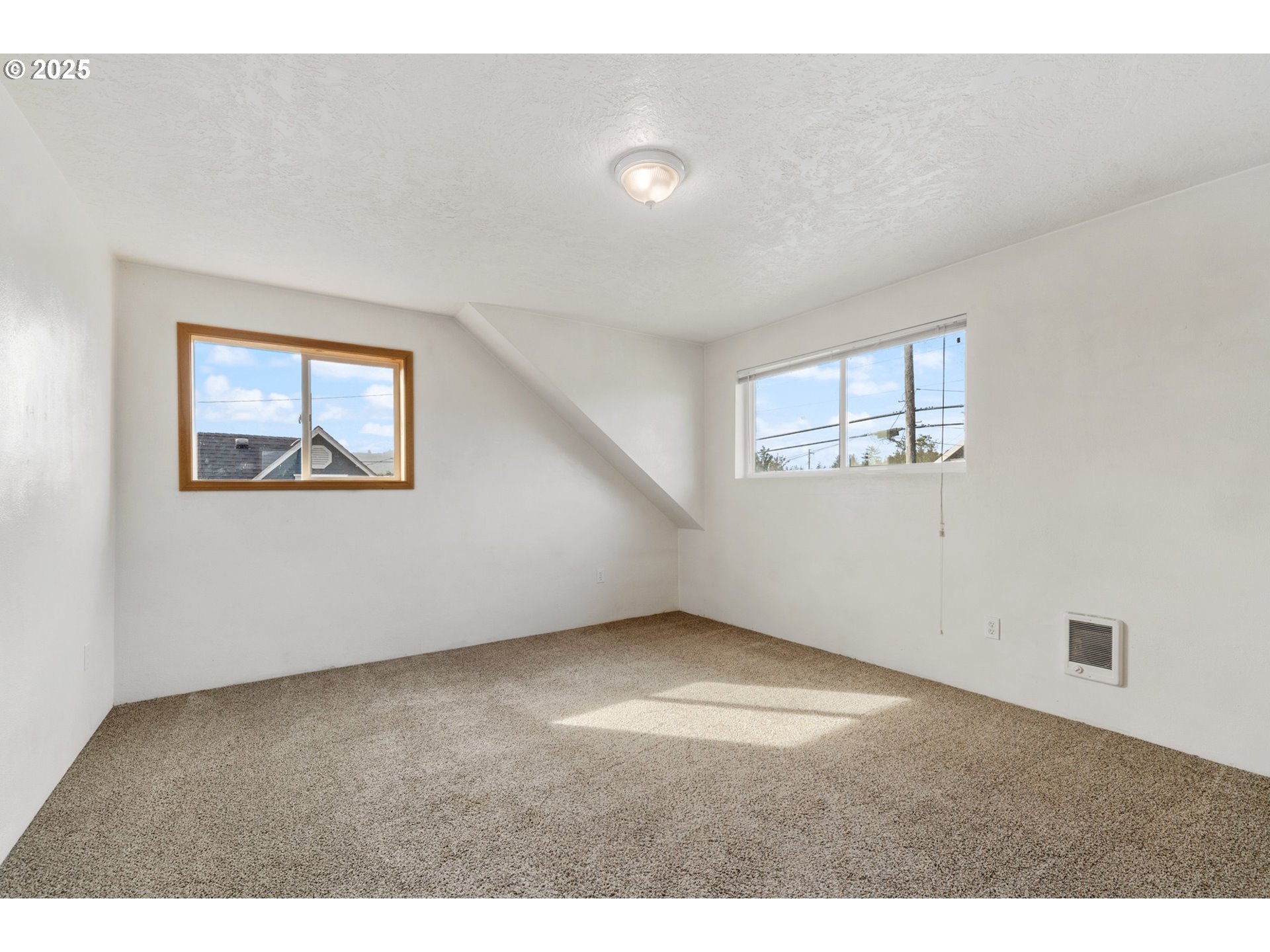 1307 3rd Street Tillamook, OR 97141 - Photo 28 of 42 a view of an empty room with a window