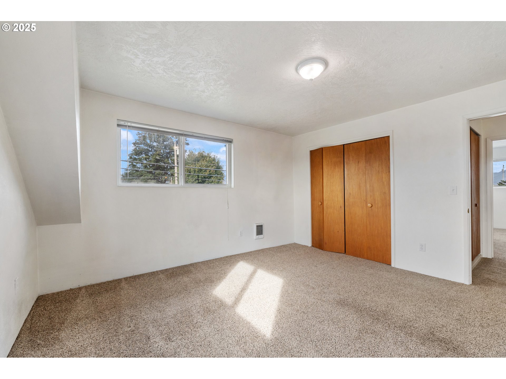 1307 3rd Street Tillamook, OR 97141 - Photo 29 of 42 a view of an empty room with windows