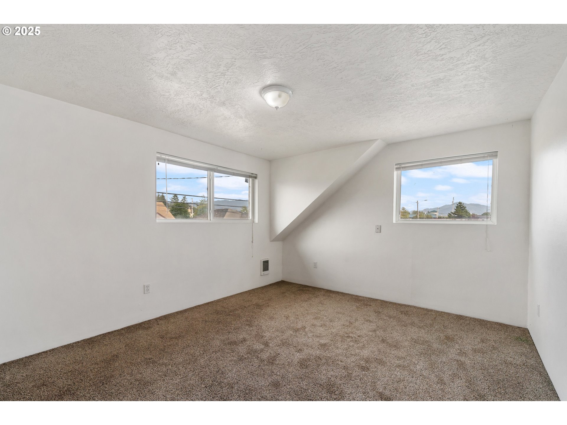 1307 3rd Street Tillamook, OR 97141 - Photo 30 of 42 a view of an empty room with a window