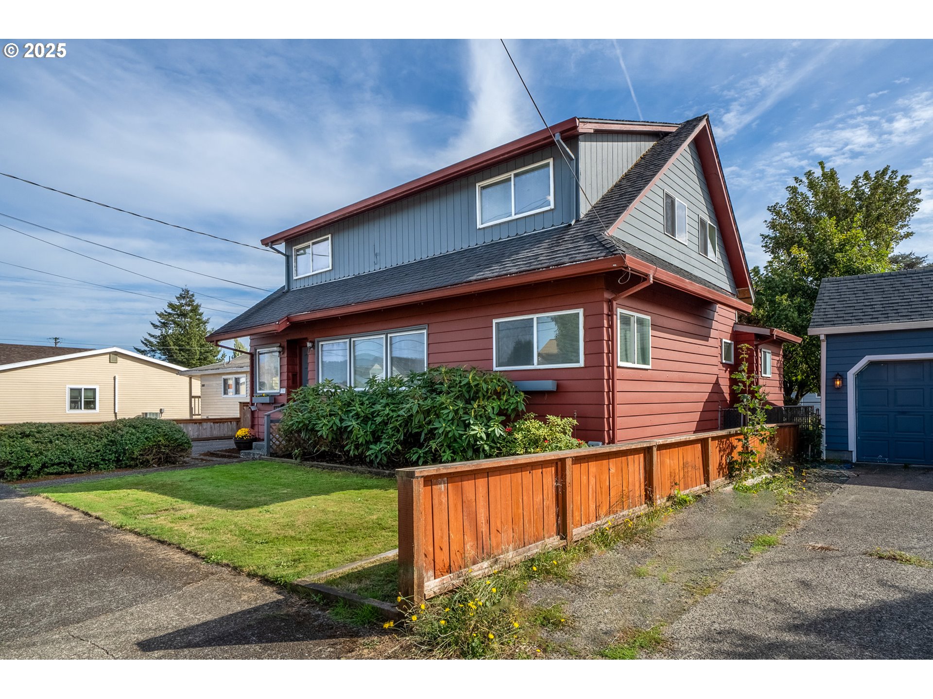1307 3rd Street Tillamook, OR 97141 - Photo 3 of 42 a front view of a house with a yard