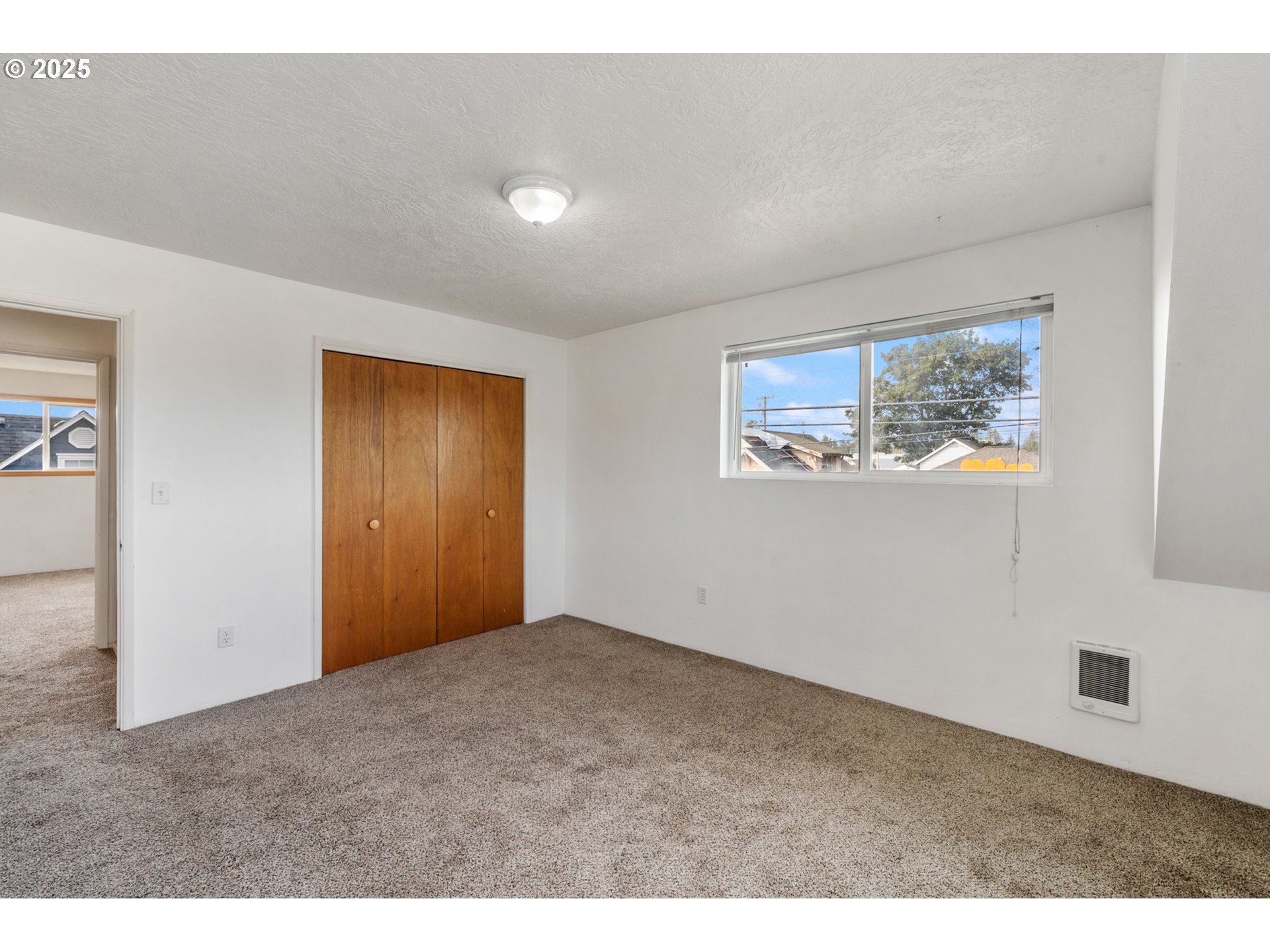 1307 3rd Street Tillamook, OR 97141 - Photo 31 of 42 a view of an empty room with a window