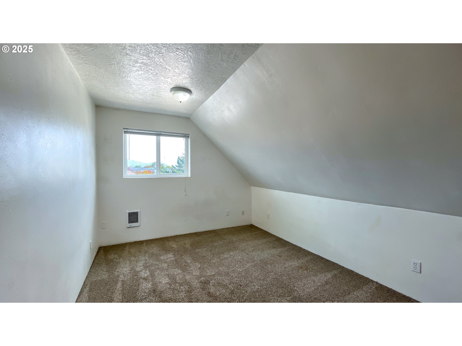 1307 3rd Street Tillamook, OR 97141 - Photo 32 of 42 a open hall with a bench