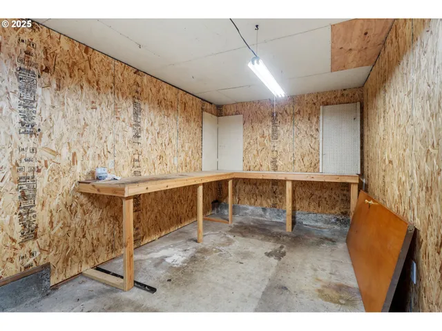 a view of an empty room with a fireplace