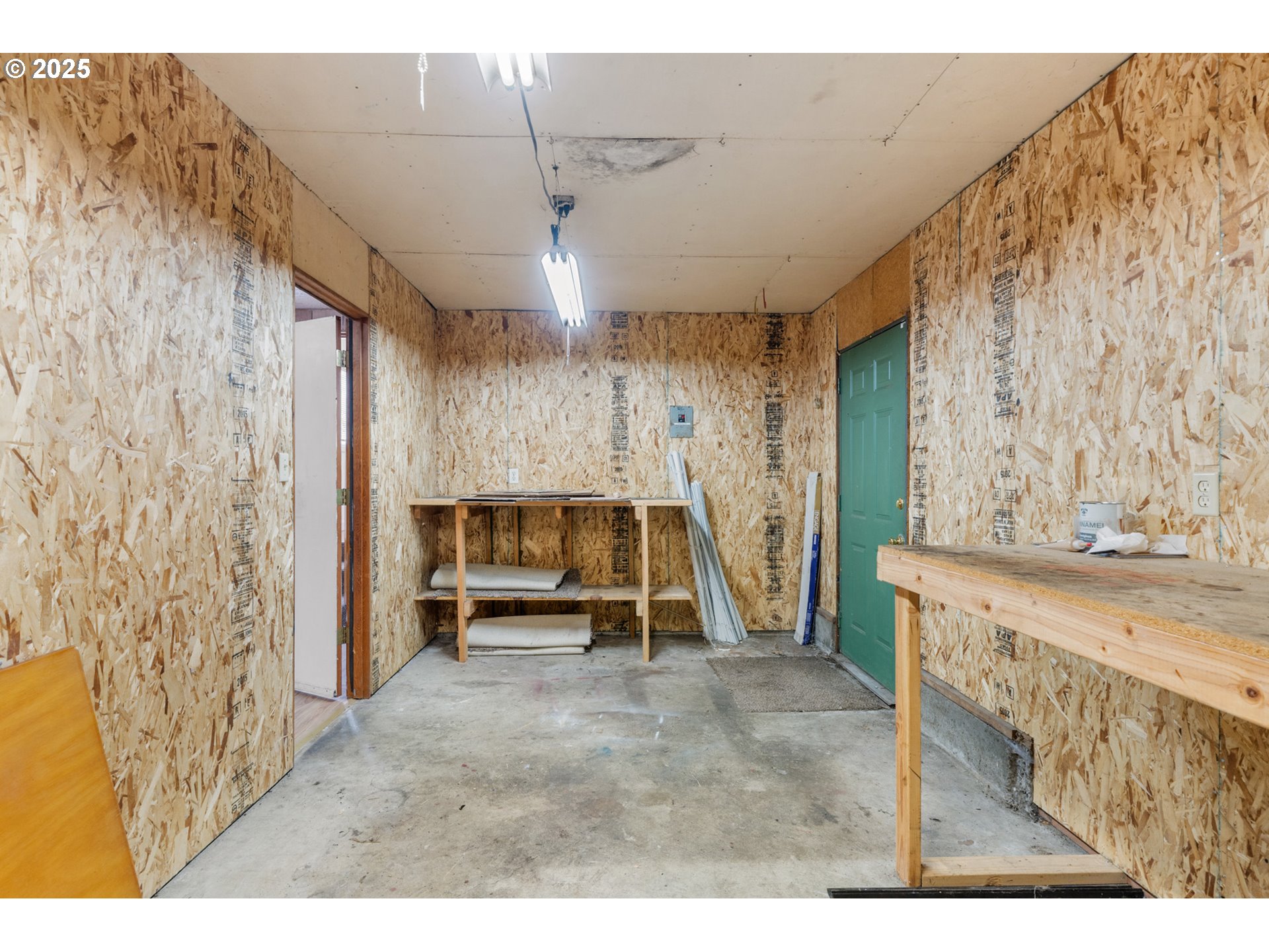 1307 3rd Street Tillamook, OR 97141 - Photo 37 of 42 a view of an empty room with a fireplace