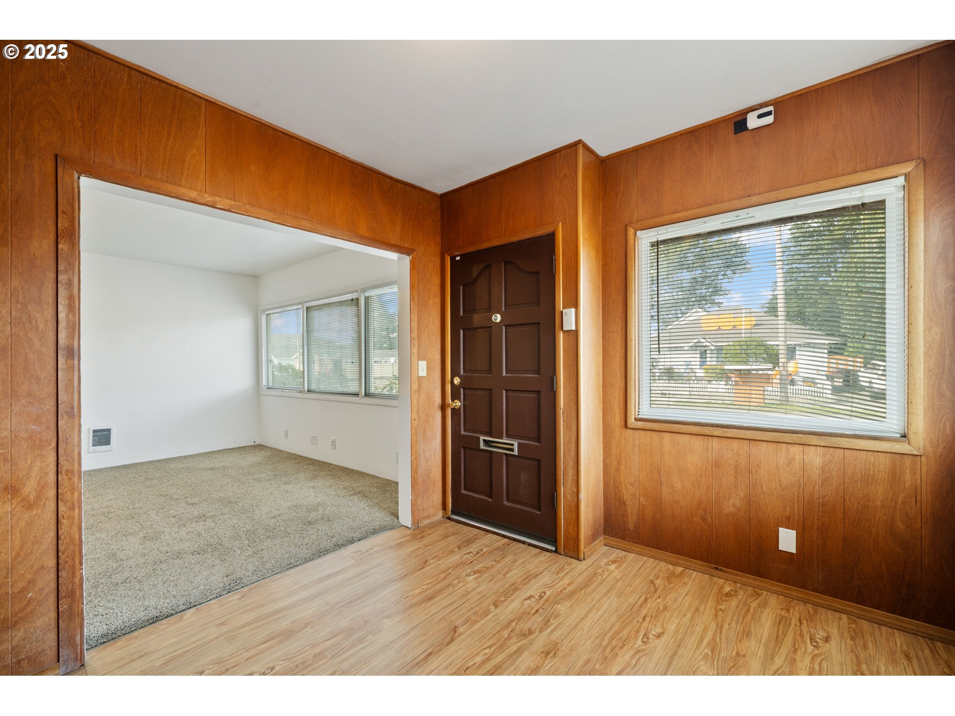 1307 3rd Street Tillamook, OR 97141 - Photo 7 of 42 en empty room with window and wooden floor