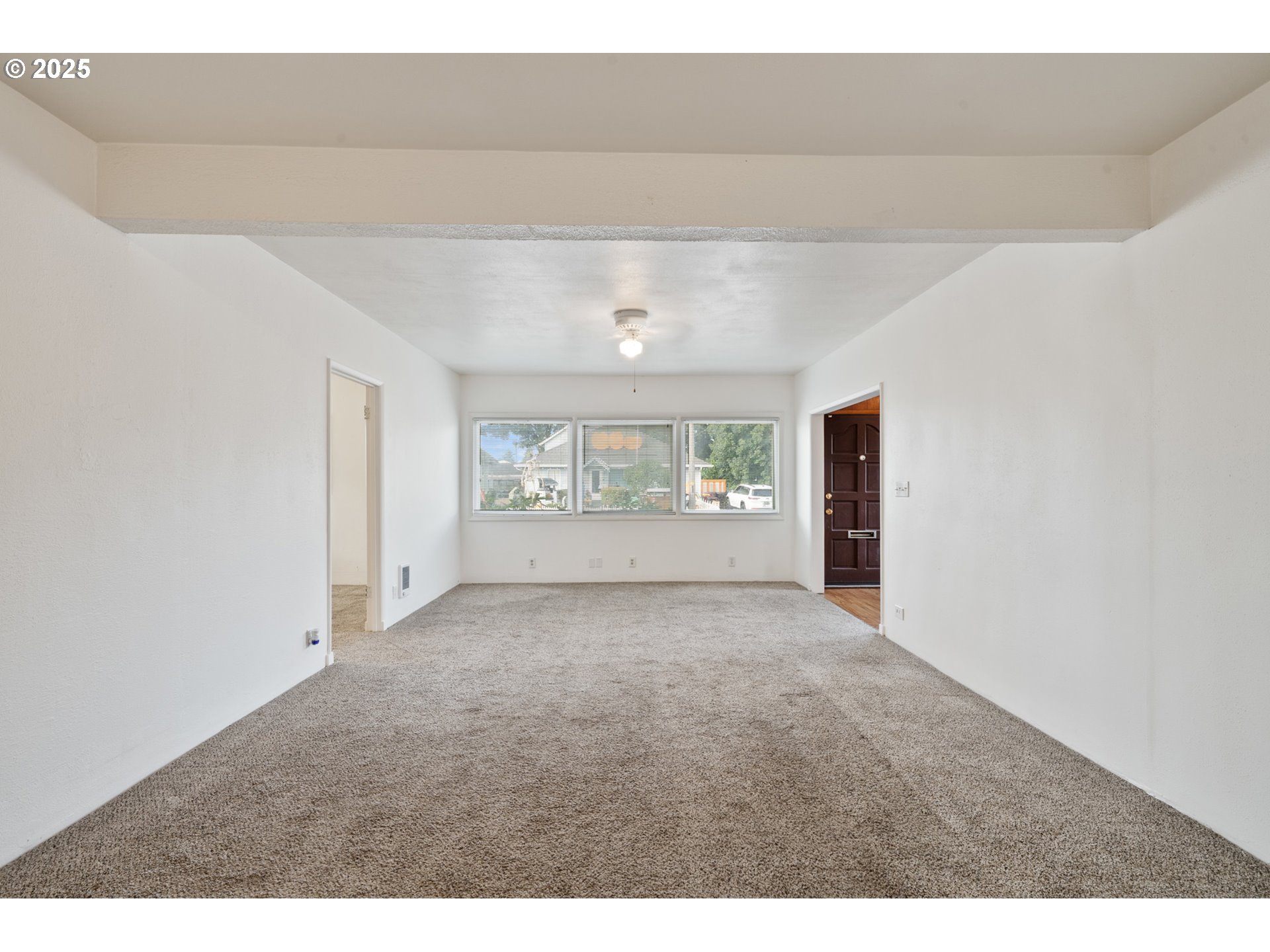 1307 3rd Street Tillamook, OR 97141 - Photo 9 of 42 a view of an empty room with a window