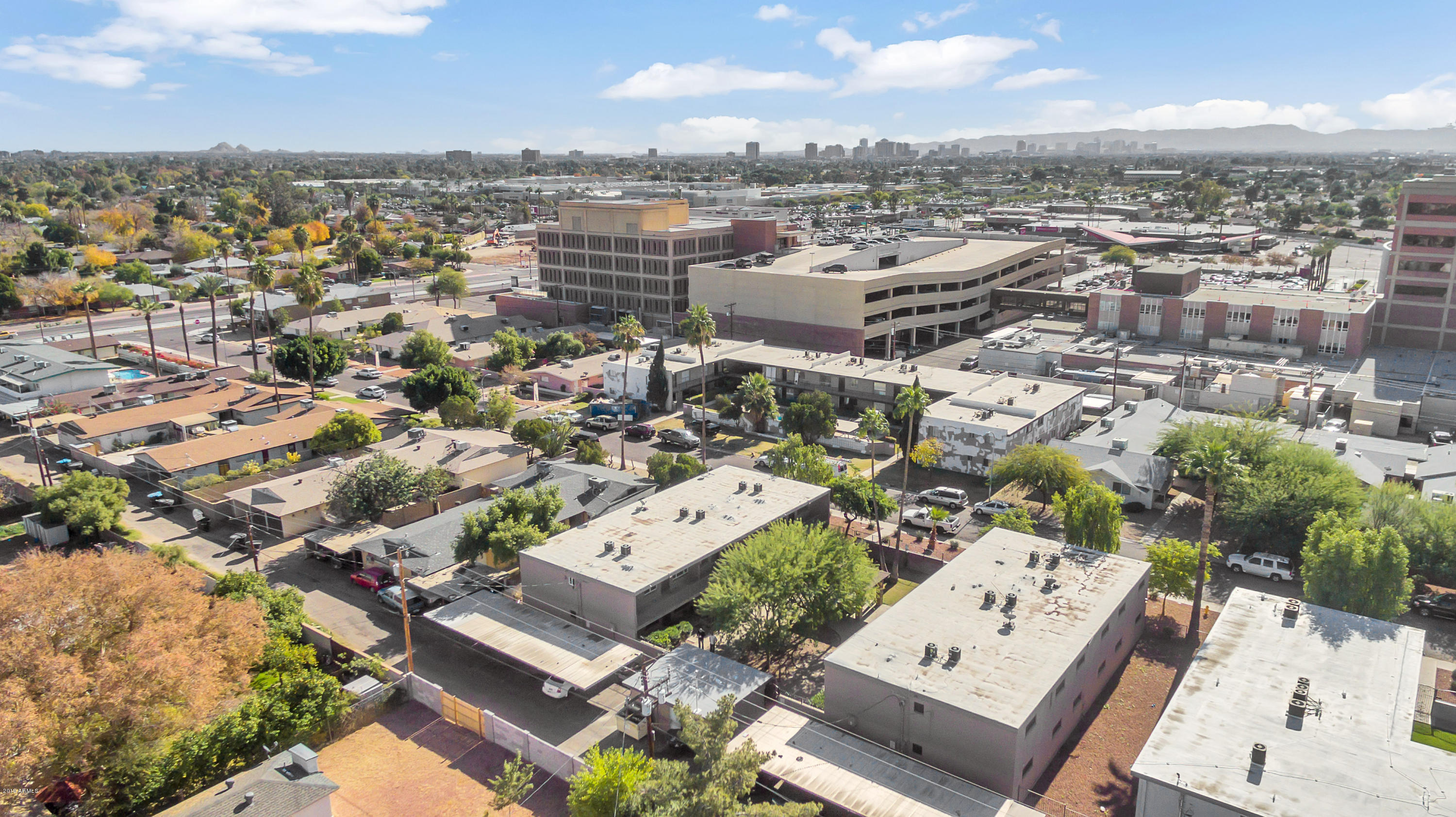 1942 West Berridge Lane Phoenix, AZ 85015 - Photo 12 of 13 an aerial view of a city with lots of residential buildings