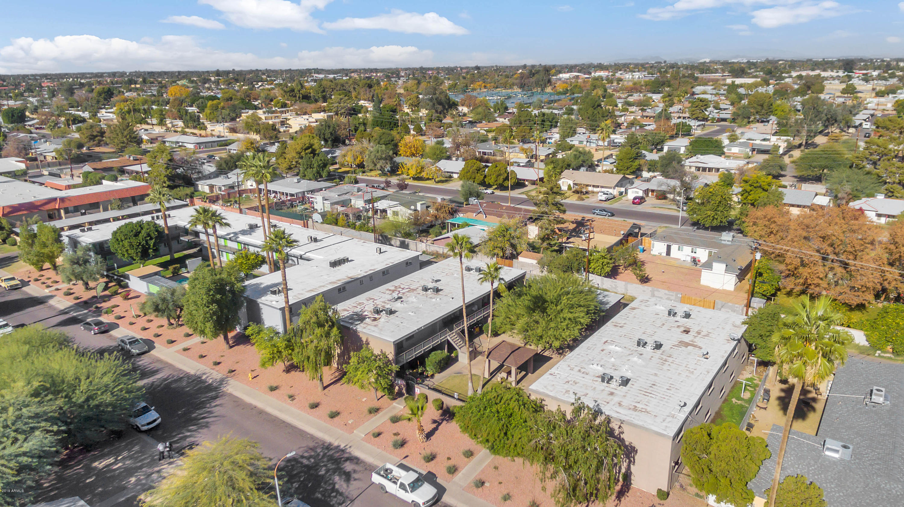 1942 West Berridge Lane Phoenix, AZ 85015 - Photo 13 of 13 an aerial view of a city with lots of residential buildings