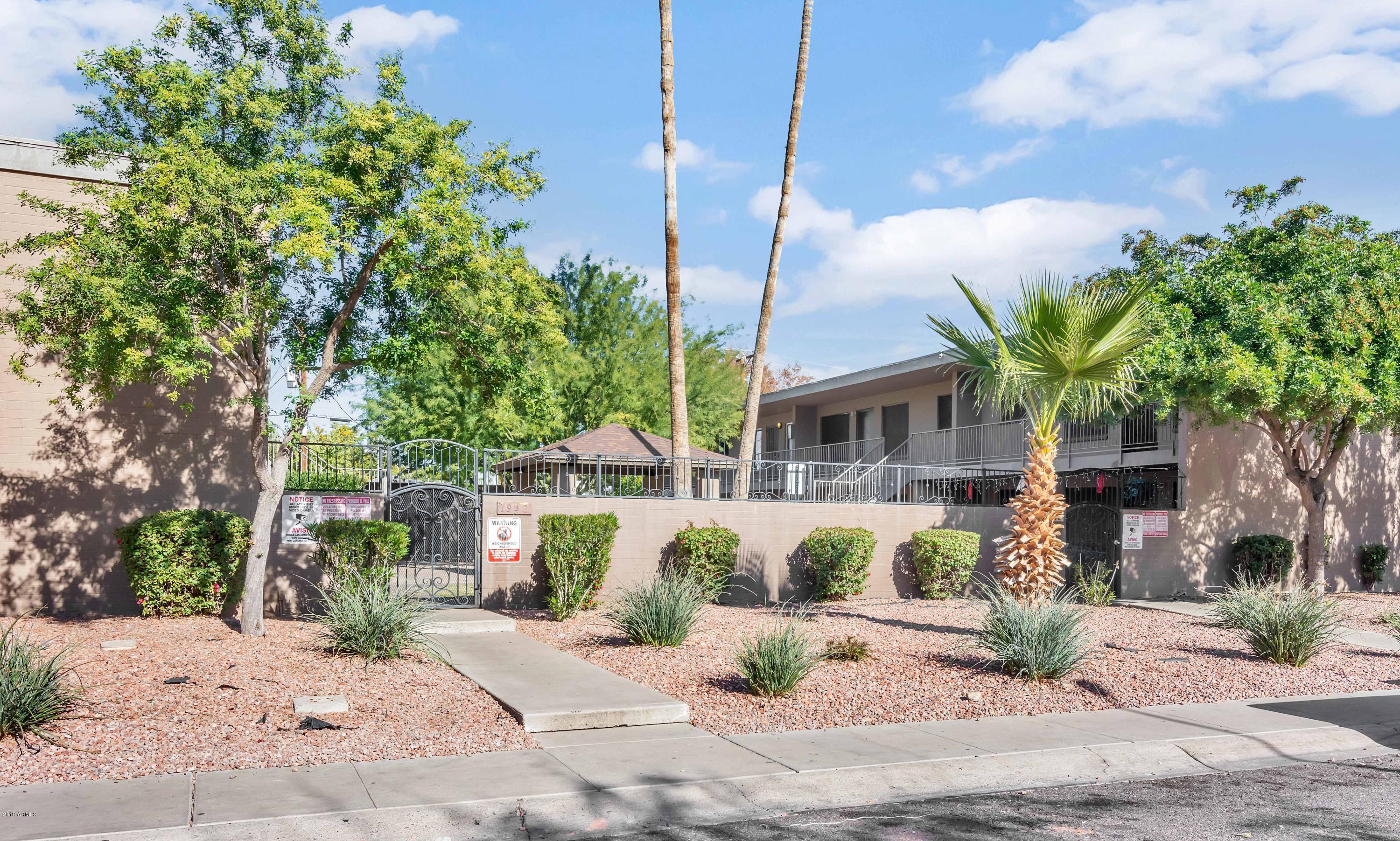 1942 West Berridge Lane Phoenix, AZ 85015 - Photo 2 of 13 a front view of a house with garden and plants