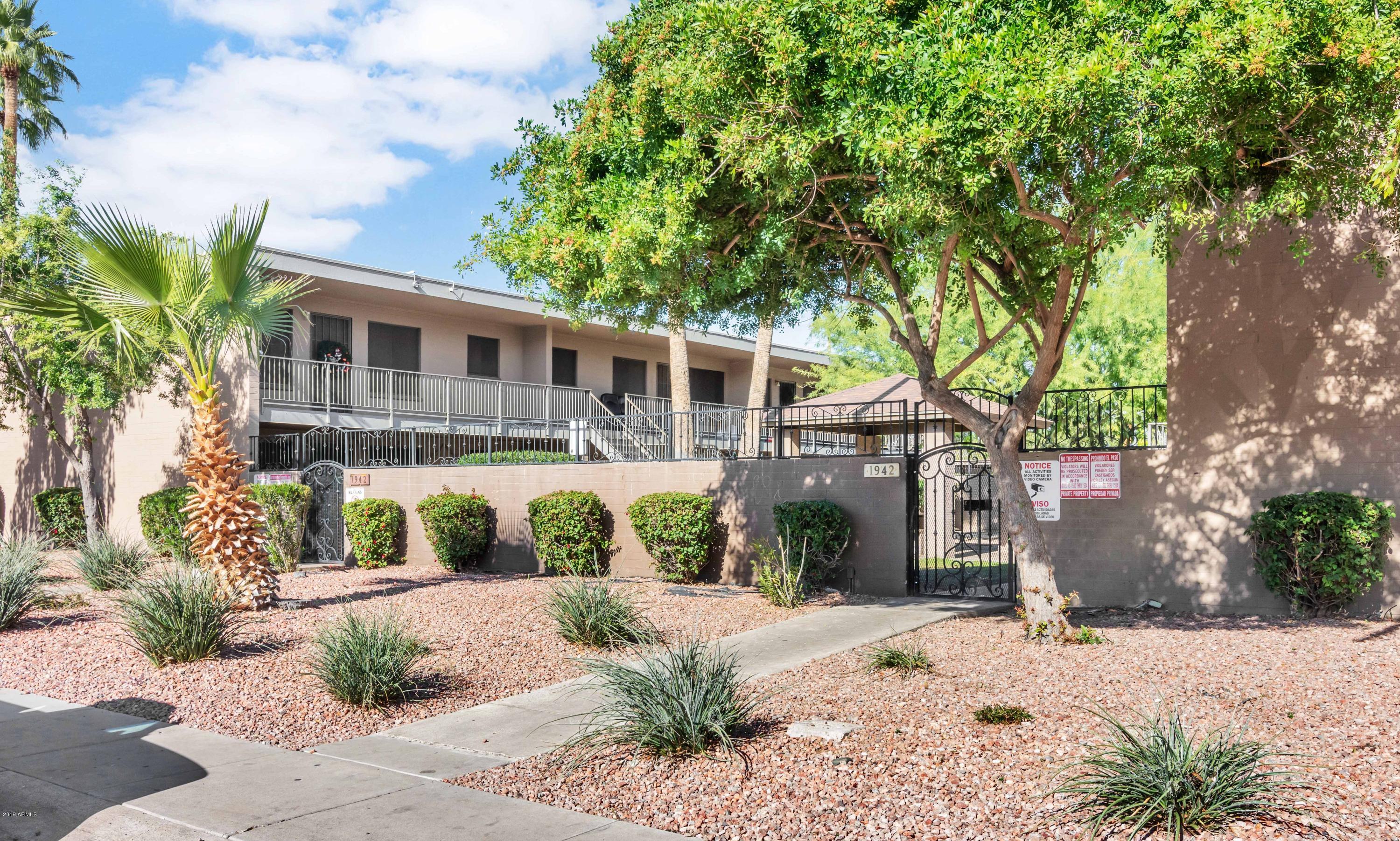 1942 West Berridge Lane Phoenix, AZ 85015 - Photo 3 of 13 a front view of a house with a yard