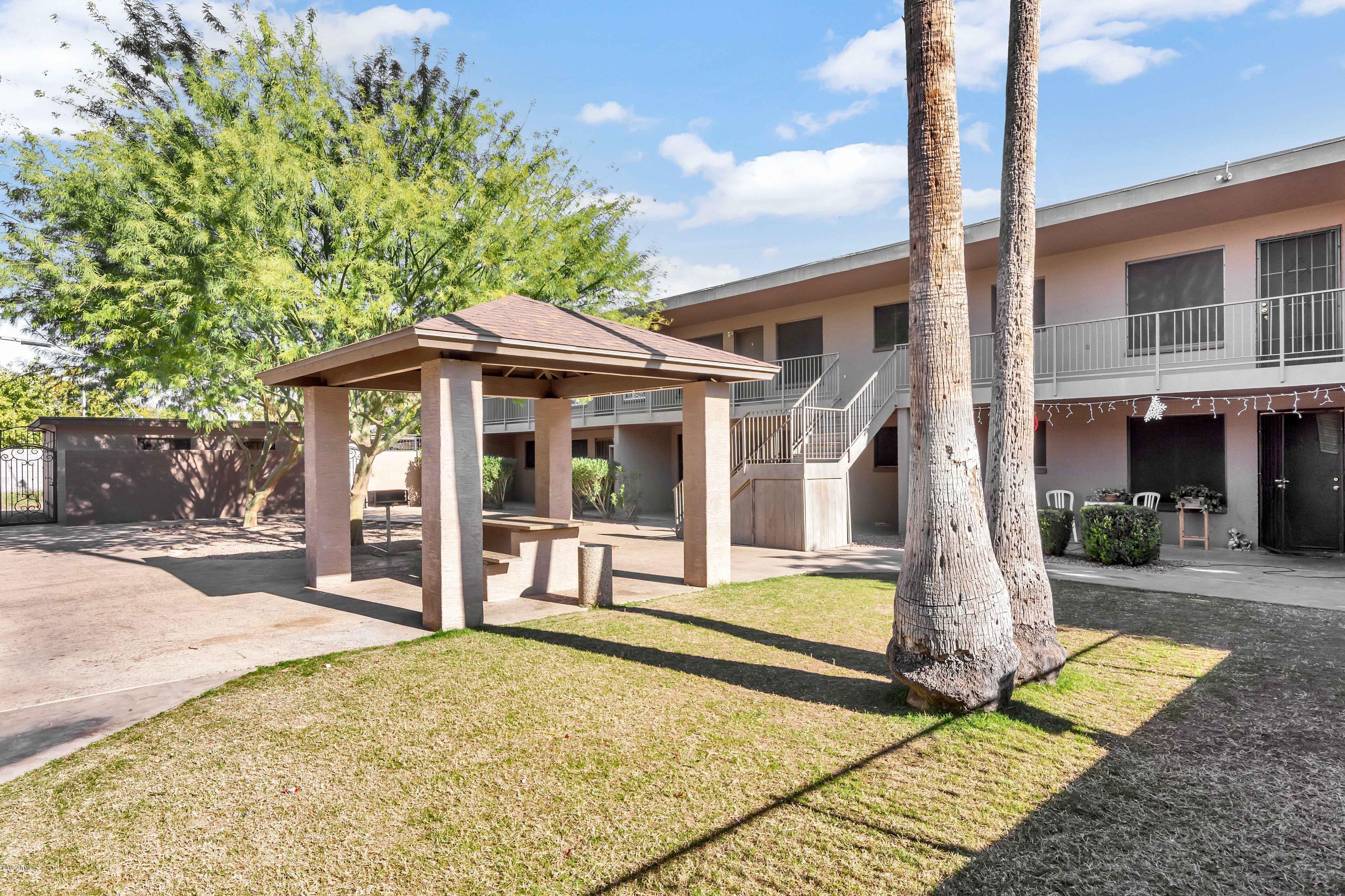 1942 West Berridge Lane Phoenix, AZ 85015 - Photo 8 of 13 a front view of a house with garden