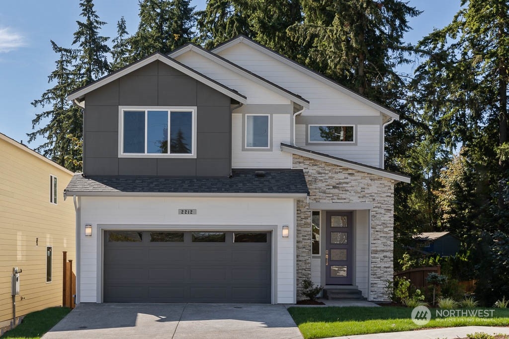 2017 228th Place Southwest, Unit EP 3 Bothell, WA 98021 - Photo 1 of 20 a front view of a house with a garden