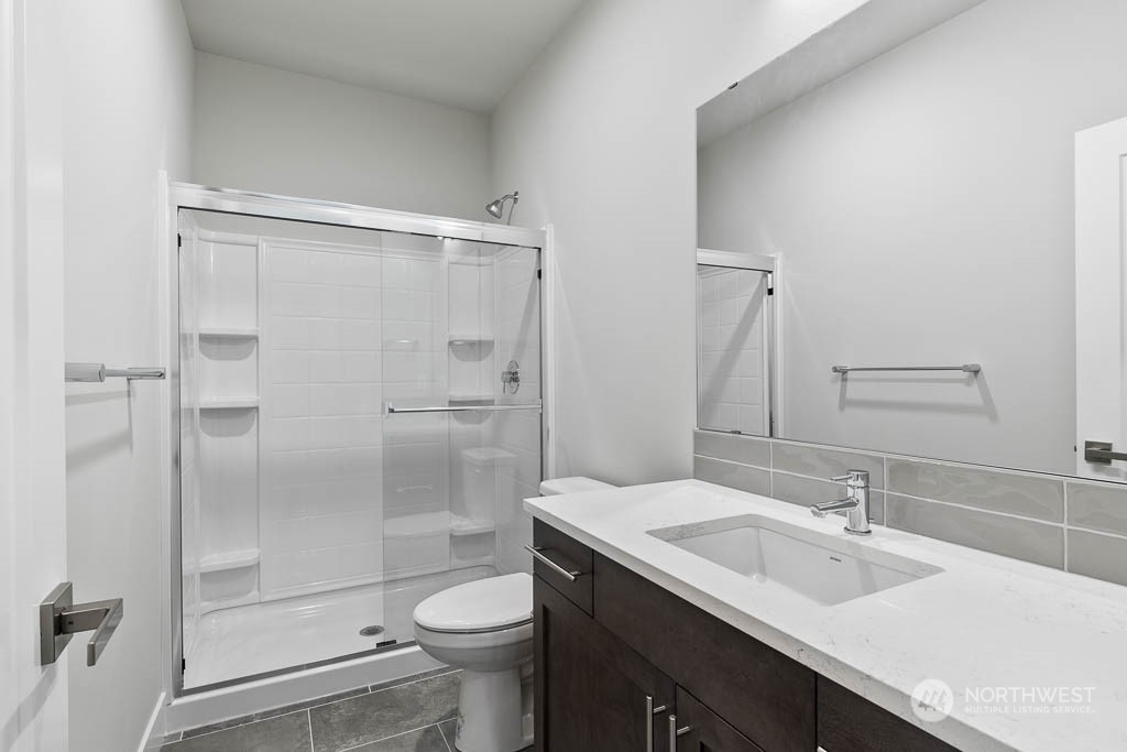 2017 228th Place Southwest, Unit EP 3 Bothell, WA 98021 - Photo 5 of 20 a bathroom with a sink toilet and shower