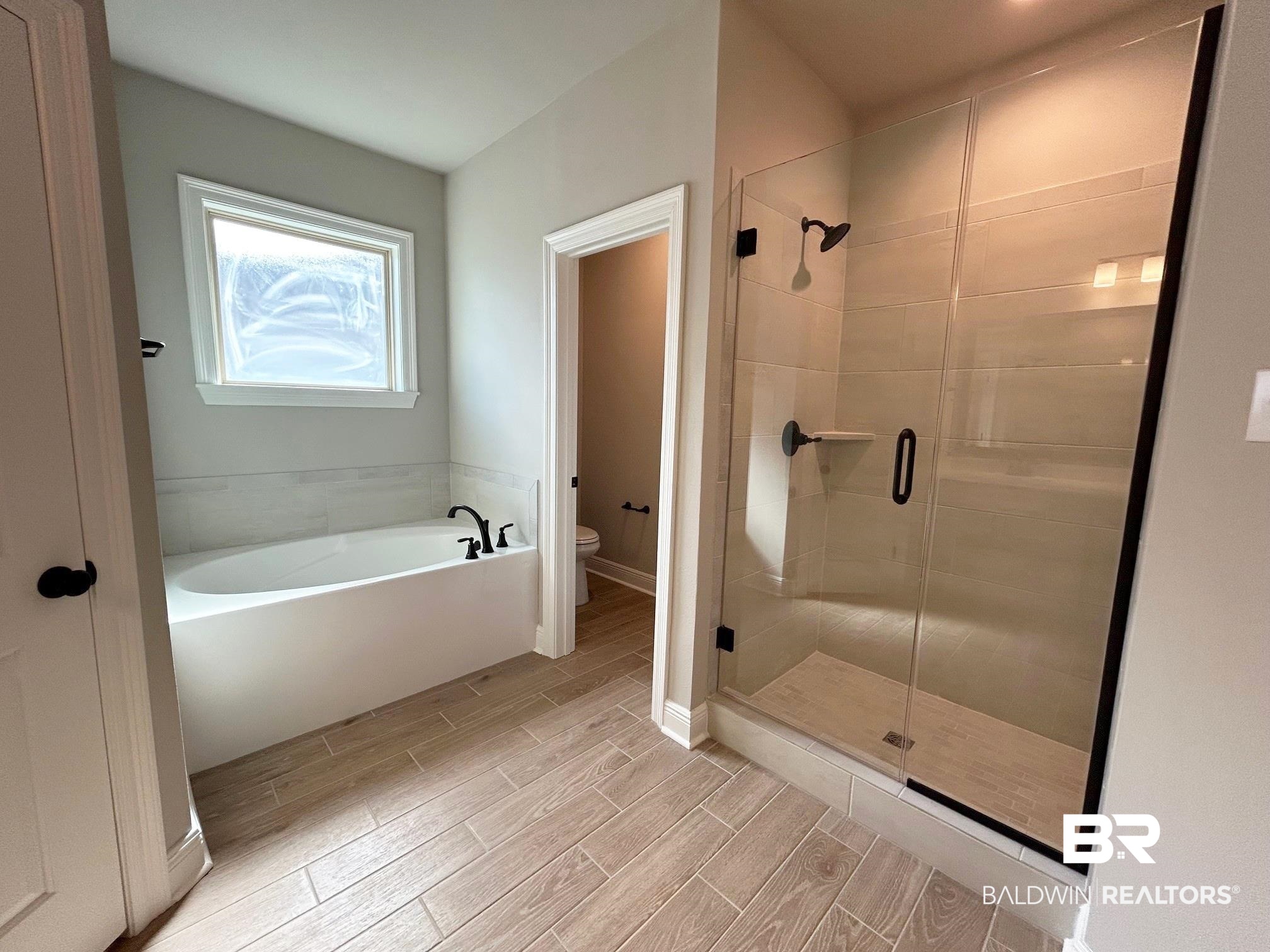 808 Sumter Loop Foley, AL 36535 - Photo 10 of 18 Bathroom featuring toilet and independent shower and bath
