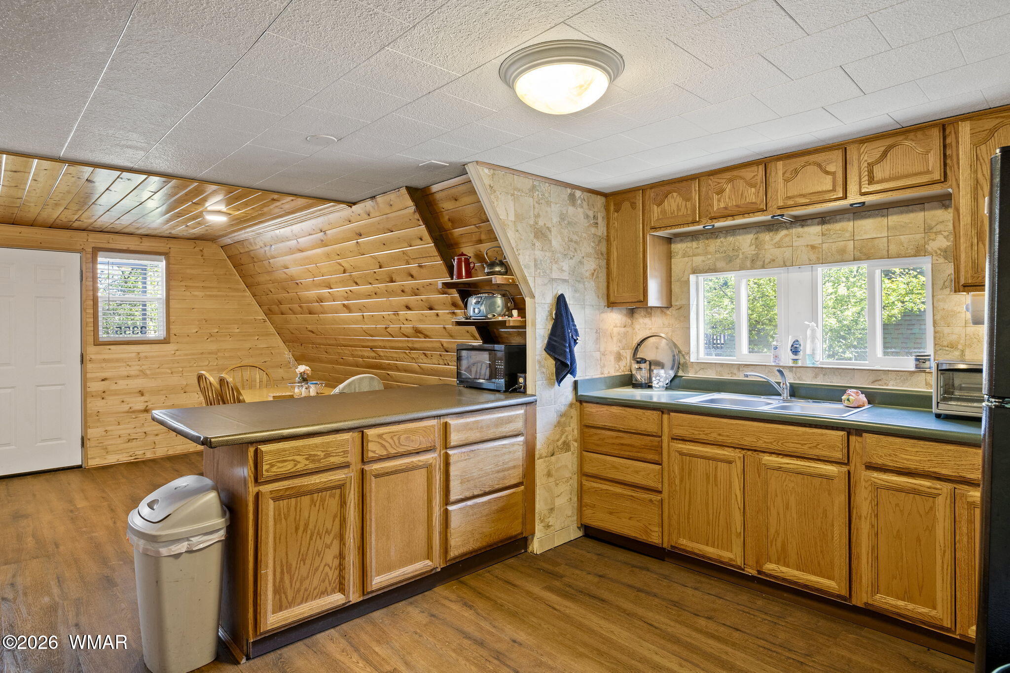 3355 Rim Lakes Drive Overgaard, AZ 85933 - Photo 11 of 37 a kitchen with sink cabinets and wooden floor