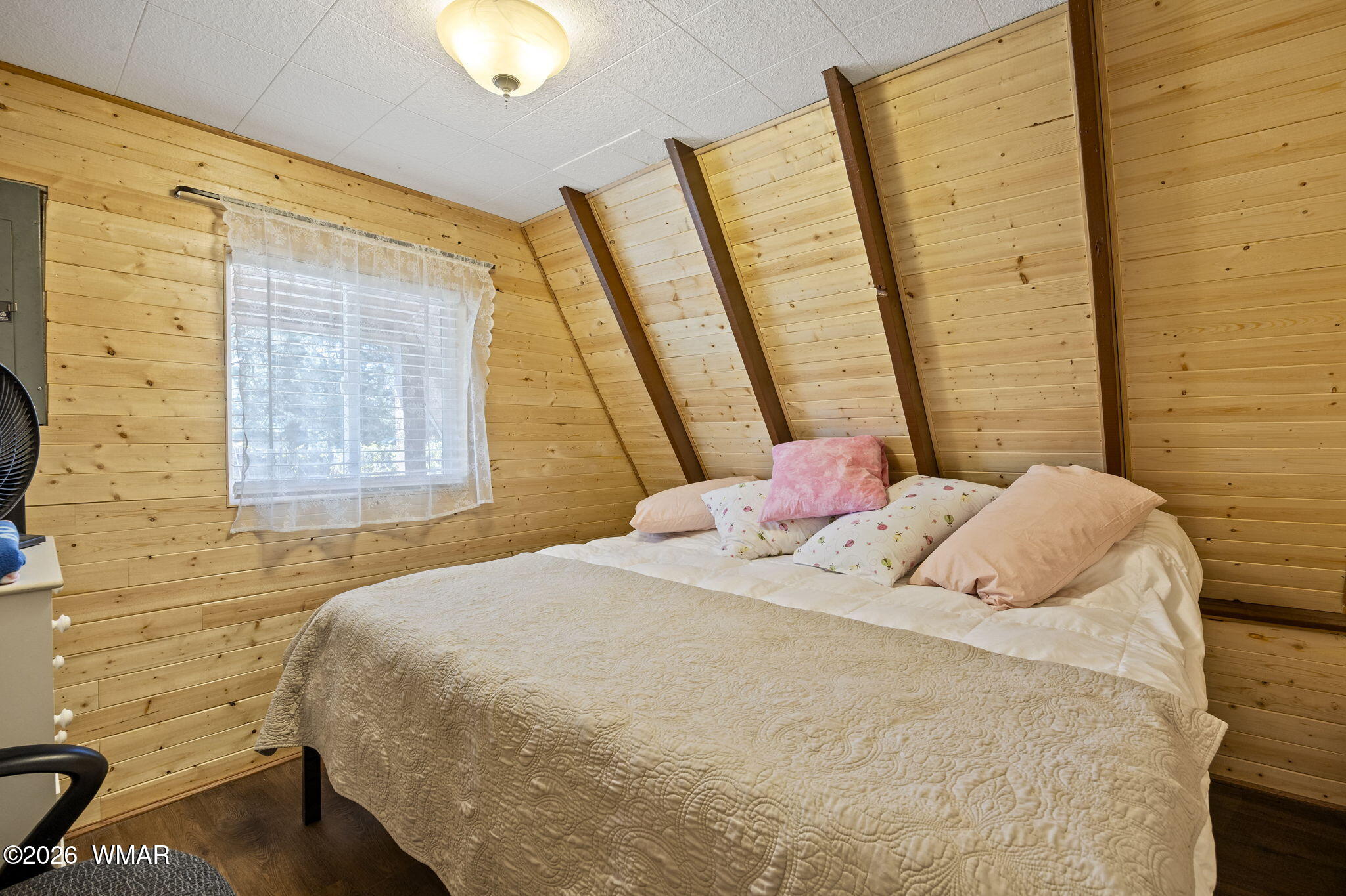 3355 Rim Lakes Drive Overgaard, AZ 85933 - Photo 13 of 37 a bedroom with a bed and a window