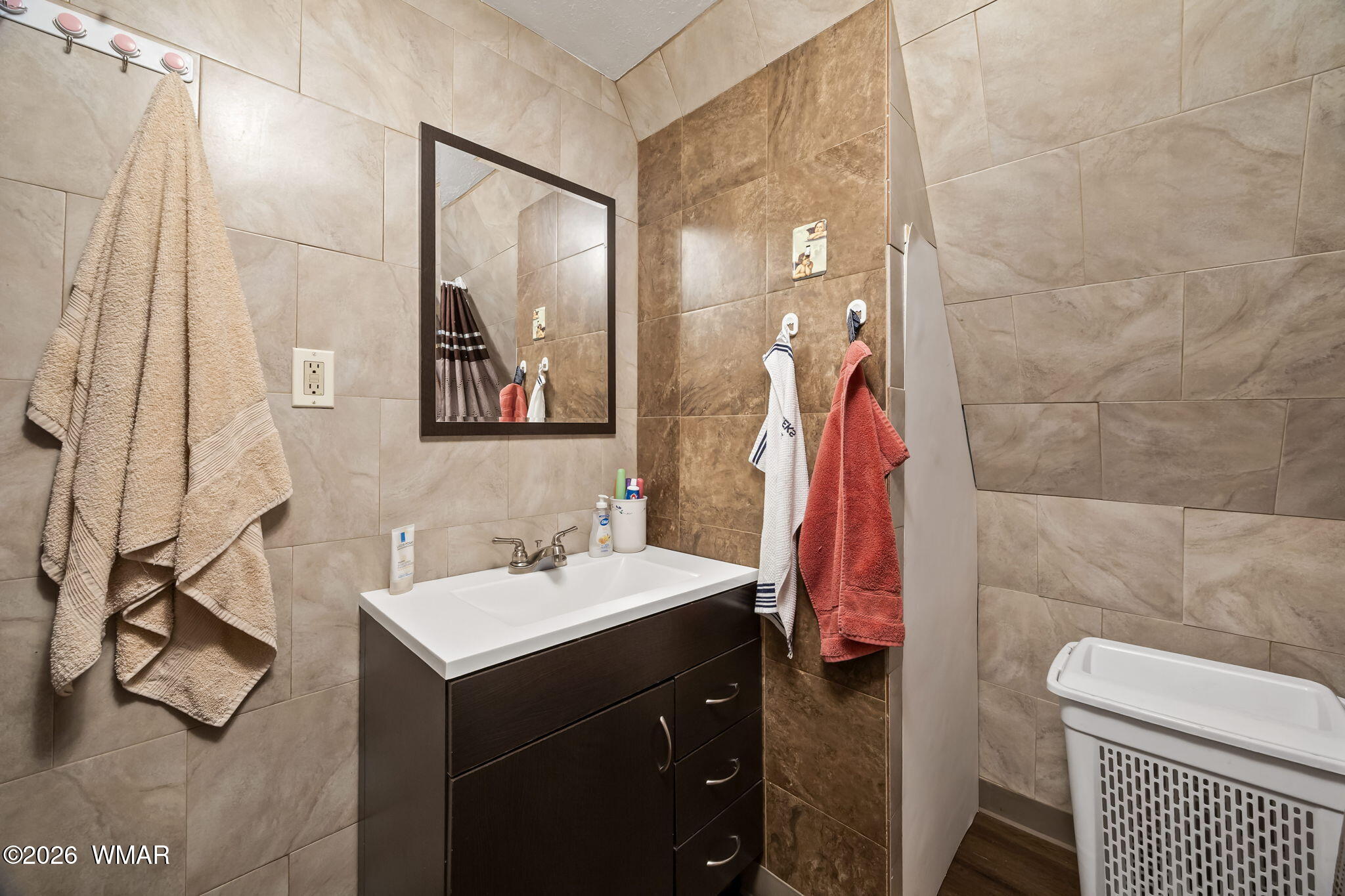 3355 Rim Lakes Drive Overgaard, AZ 85933 - Photo 15 of 37 a bathroom with a sink and mirror with toilet