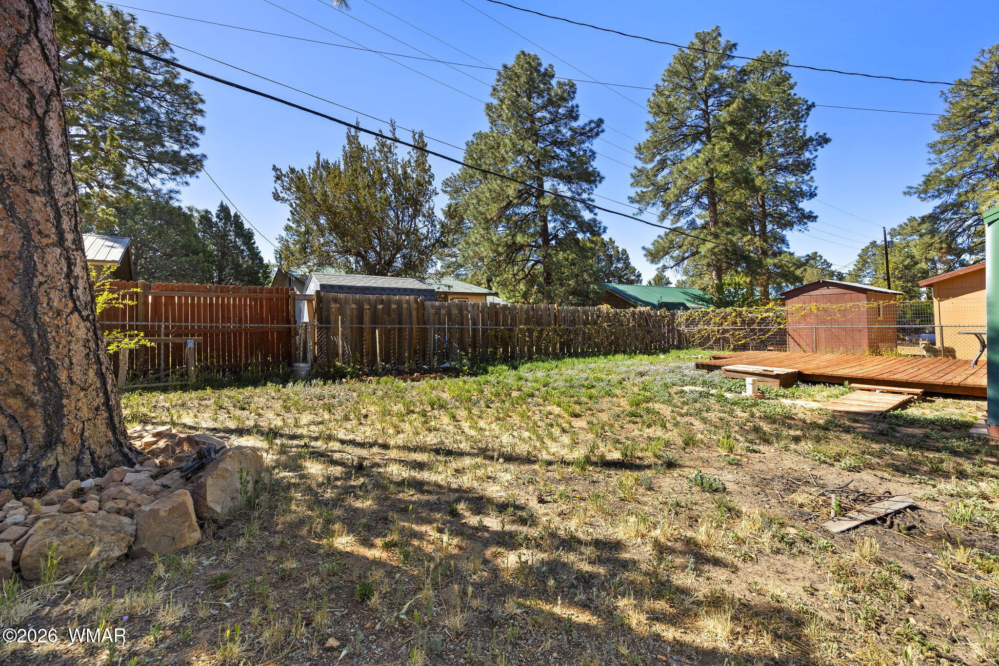 3355 Rim Lakes Drive Overgaard, AZ 85933 - Photo 24 of 37 a view of a yard with wooden fence