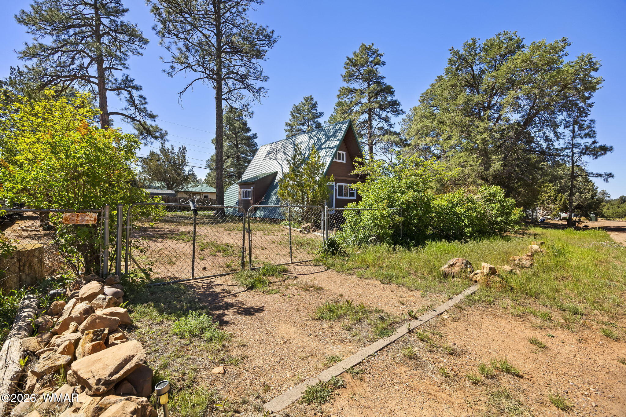 3355 Rim Lakes Drive Overgaard, AZ 85933 - Photo 25 of 37 a view of a yard with a tree