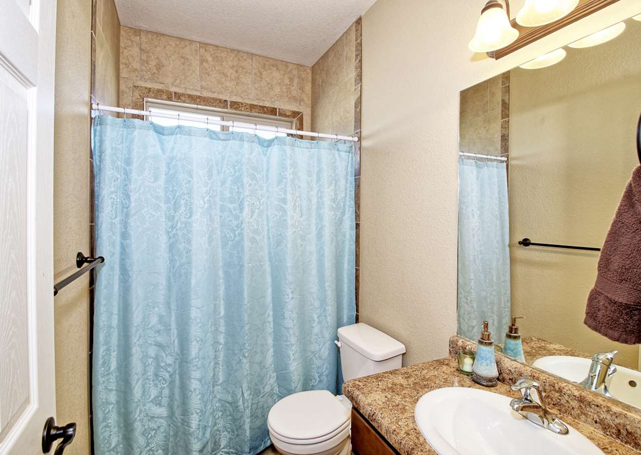 2045 Roma Avenue Fruita, CO 81521 - Photo 14 of 29 a bathroom with a sink toilet and shower