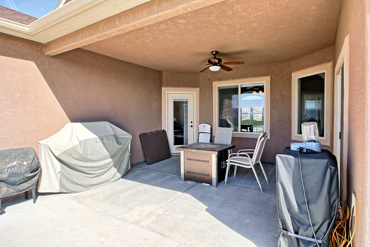 2045 Roma Avenue Fruita, CO 81521 - Photo 23 of 29 a bedroom with furniture and a chair