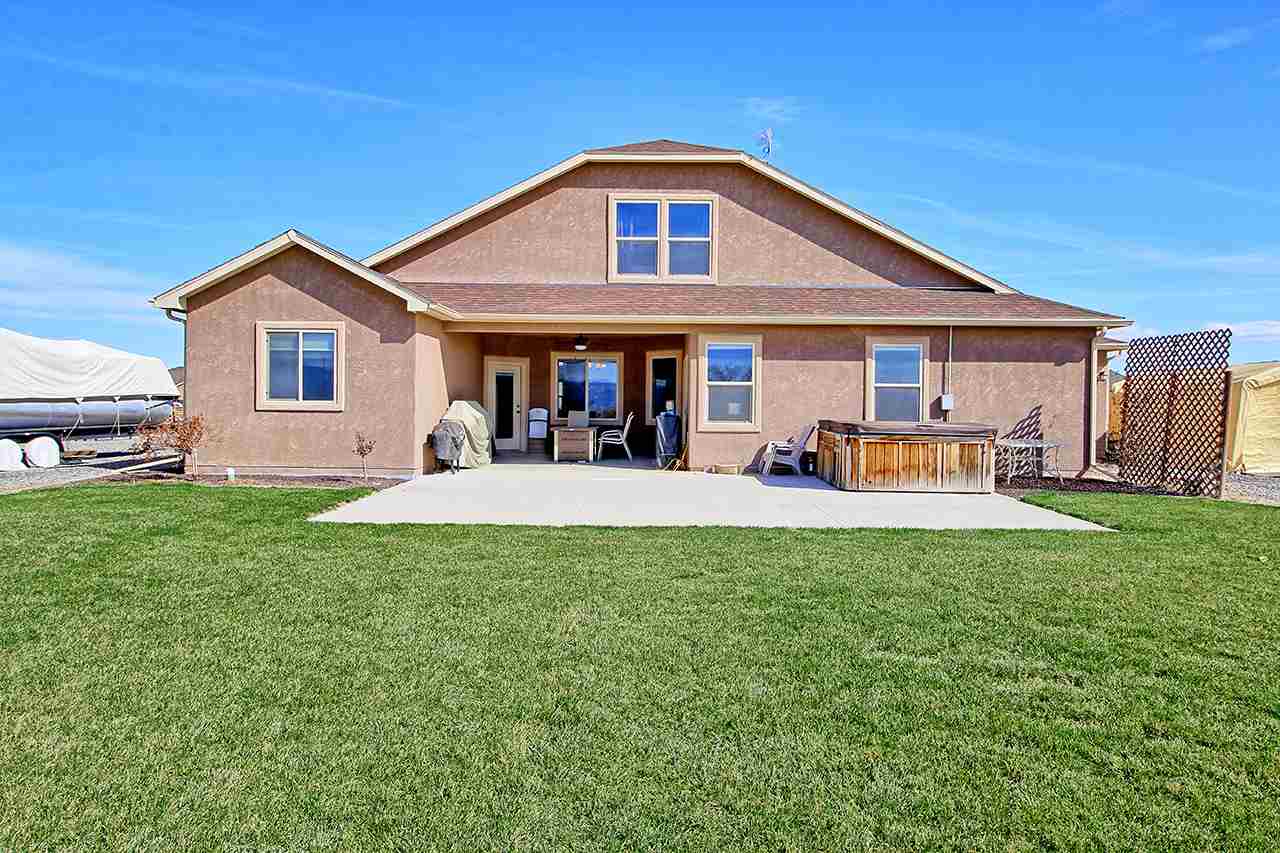 2045 Roma Avenue Fruita, CO 81521 - Photo 24 of 29 a front view of house with yard and seating area