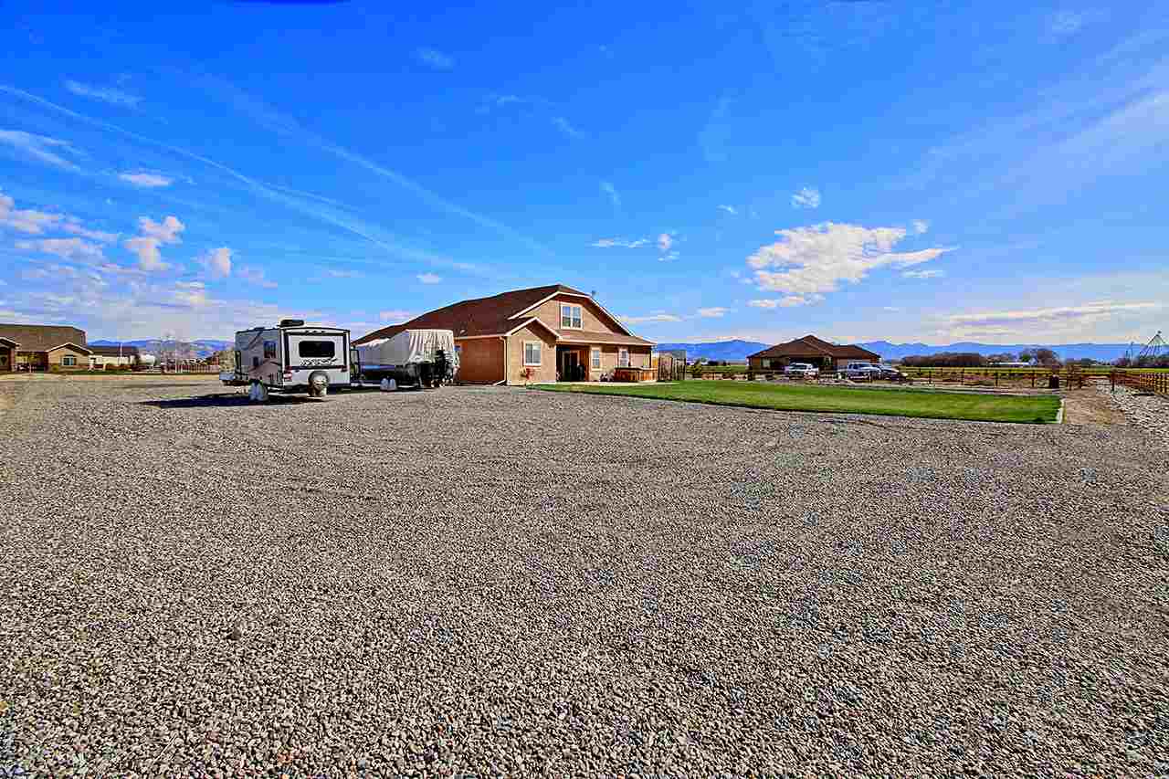 2045 Roma Avenue Fruita, CO 81521 - Photo 29 of 29 a view of a big yard with an outdoor space