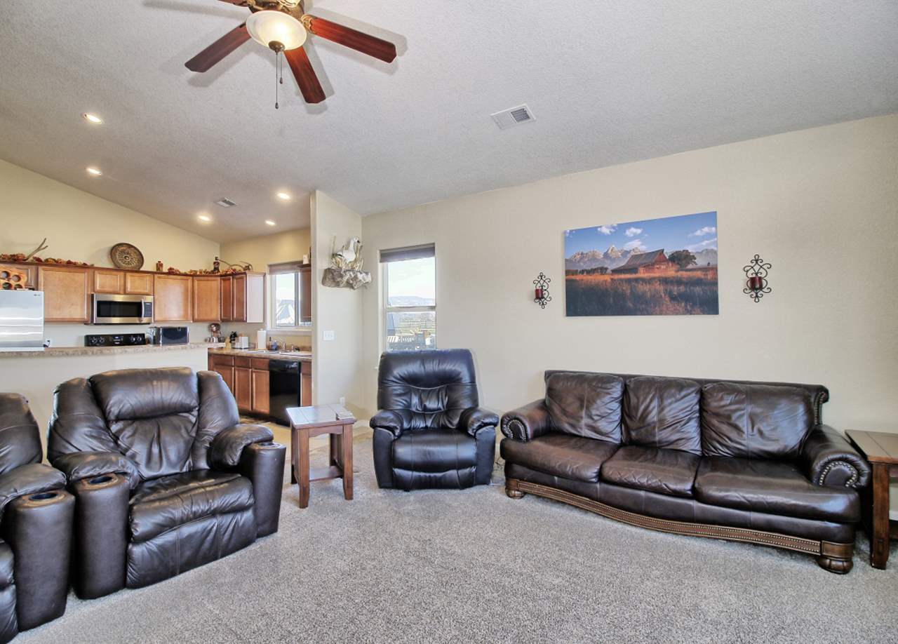 2045 Roma Avenue Fruita, CO 81521 - Photo 3 of 29 a living room with furniture and kitchen view