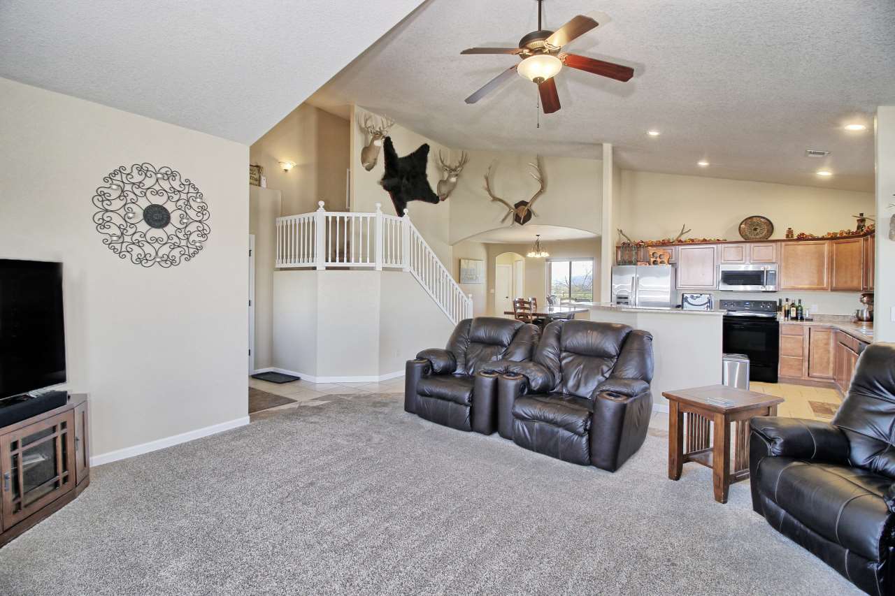 2045 Roma Avenue Fruita, CO 81521 - Photo 4 of 29 a living room with furniture and a flat screen tv