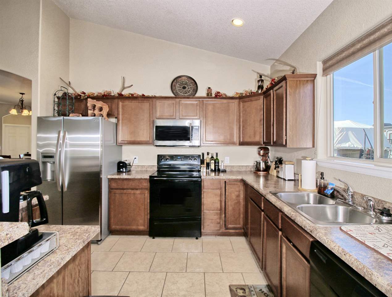 2045 Roma Avenue Fruita, CO 81521 - Photo 5 of 29 a kitchen with a sink stove and refrigerator