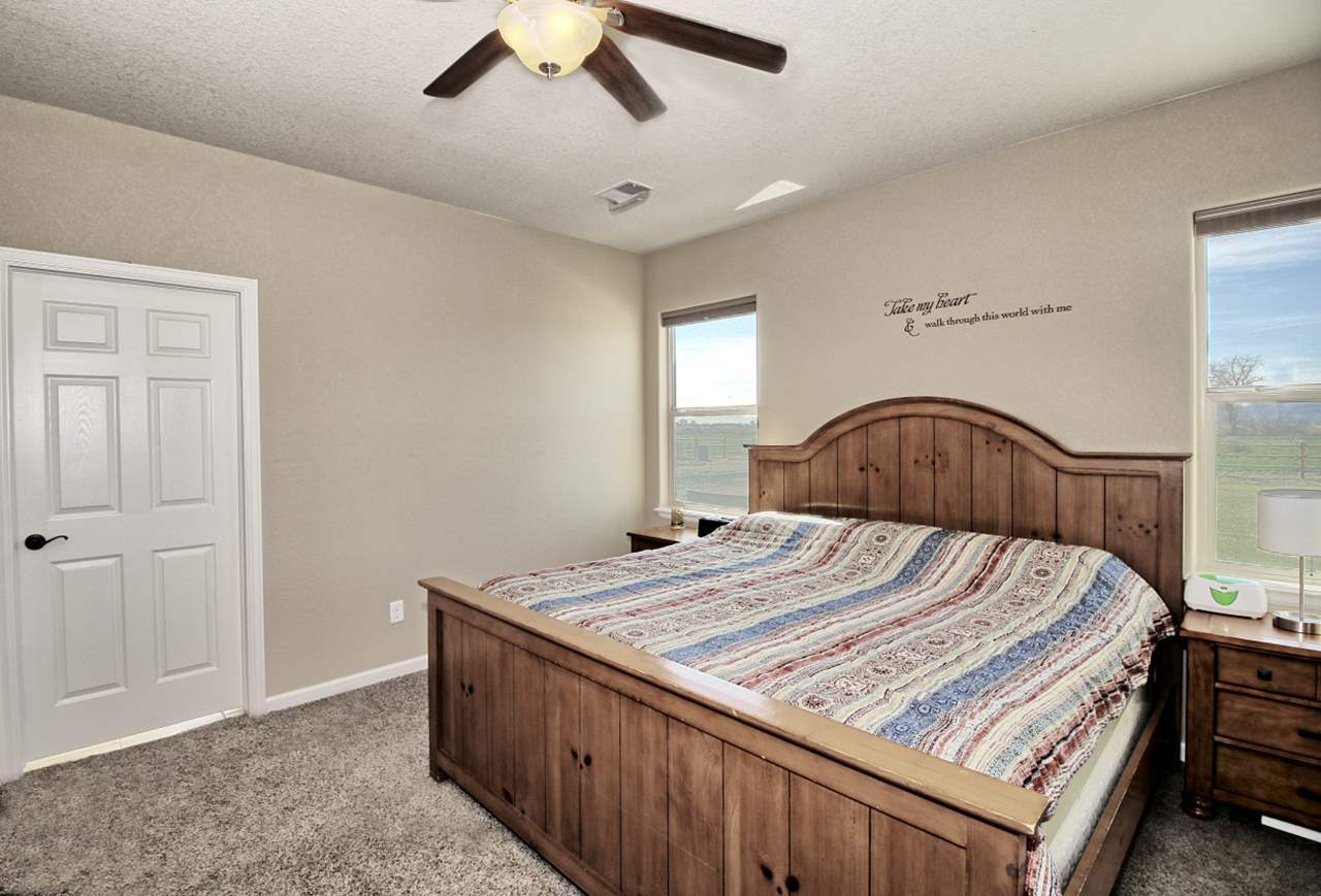 2045 Roma Avenue Fruita, CO 81521 - Photo 8 of 29 a bedroom with a bed and a dresser